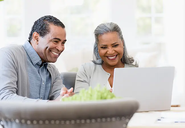 image of middle aged couple on a laptop
