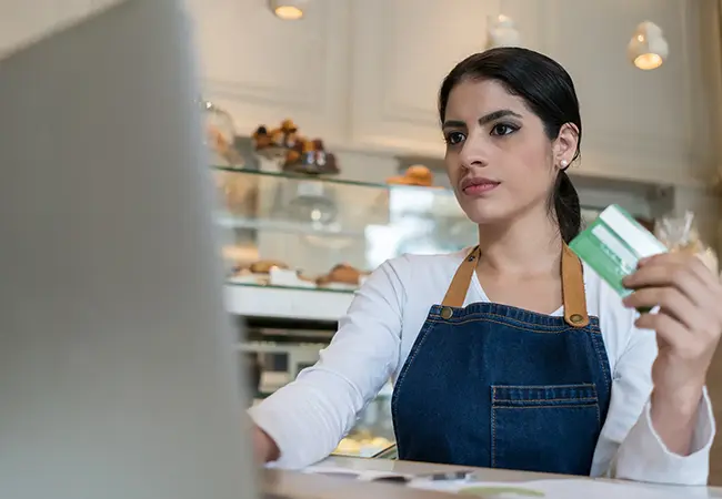 woman on laptop with credit card