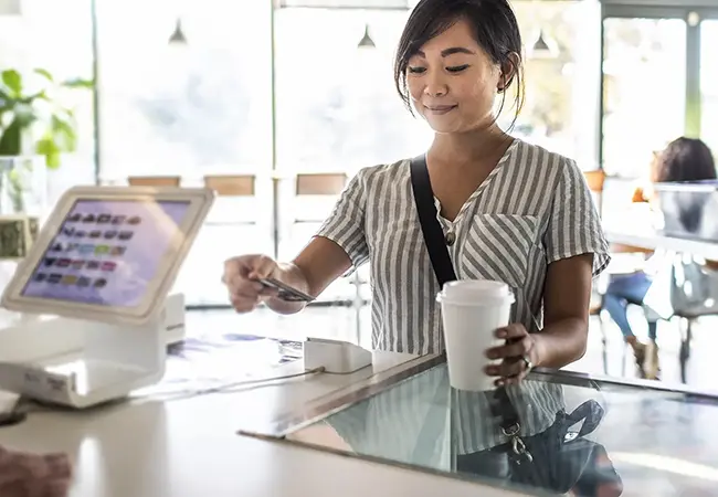 woman paying with a credit card